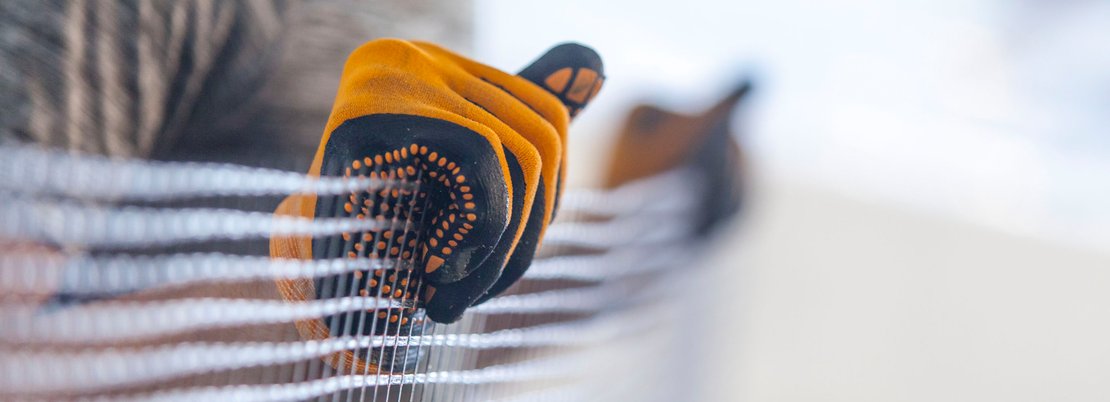 Photo shows a carbon fibre fabric during manual processing